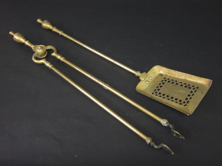A Victorian pierced brass coal shovel and a pair of tongs