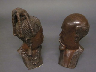 A pair of African carved portraits busts of a lady and gentleman  13"