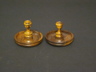 A pair of turned olive wood travelling candlesticks 3"