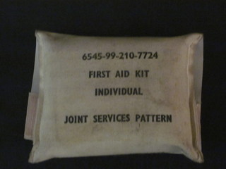 An individual first aid joint services patent dressing