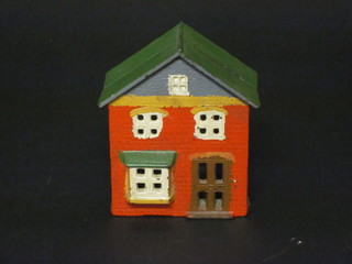 A Victorian iron money box in the form of a house 4"