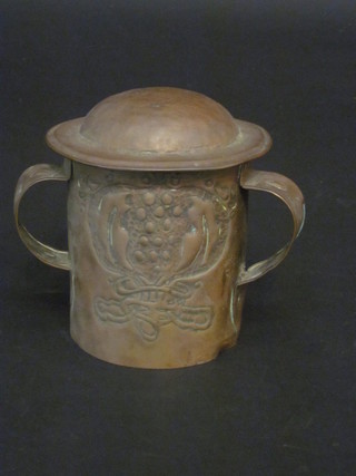 An Art Nouveau Newlyn style 3 handled copper jar and cover  with embossed decoration, hole to base, 4"