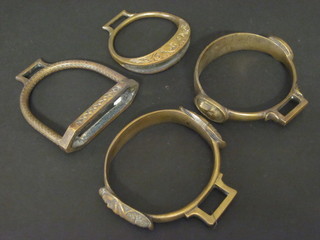 A pair of bronze stirrups and 2 others