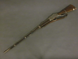 A Martini Henry rifle with 78" barrel and Arab "silver"  decoration
