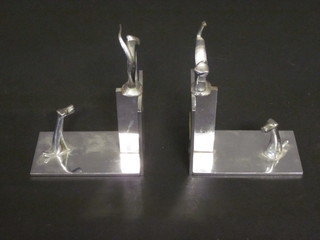 A pair of Art Deco style chromium plated bookends decorated a  cat and dog 4"