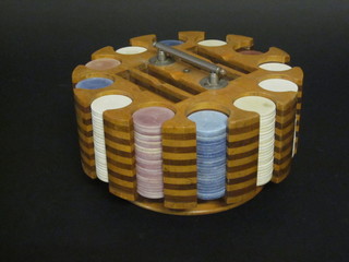 A circular Art Deco gaming counter "bank" containing a  collection of various circular counters