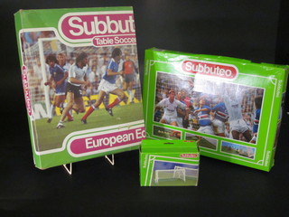A Subbuteo game no. 60140 together with a Subbuteo goal post