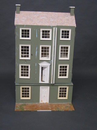A wooden dolls house in the form of a Georgian house 24"