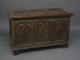 An 18th Century oak coffer of panelled construction with hinged lid 41"  ILLUSTRATED