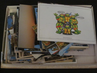 A box of various postcards etc