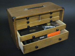 A toolmaker's chest containing 2 micrometers and various  precision tools