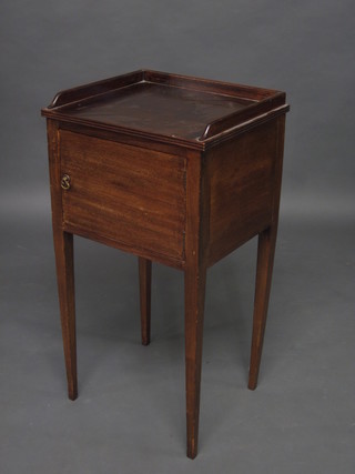 A 19th Century style mahogany bedside cabinet with  three-quarter gallery, raised on square tapering supports 16"