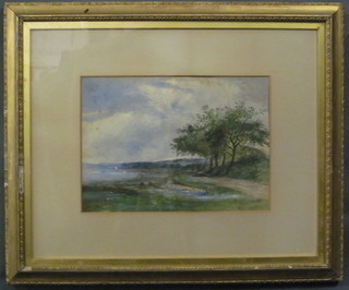 A 19th Century watercolour drawing "Track by an Estuary with  Church in Distance" 9" x 12", some foxing