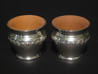 A pair of Edwardian silver circular embossed chassepot, marks  rubbed 2 ozs