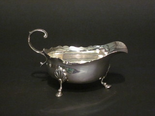 A silver sauce boat with C scroll handle, Chester, marks rubbed, 4"