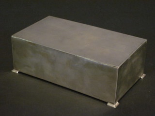 A rectangular silver cigarette box with engine turned decoration,  raised on bracket feet, Birmingham 1948, 6"   ILLUSTRATED
