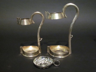 2 silver plated wine bottle holders together with a silver plated wine taster