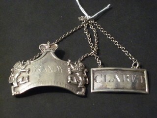 A silver decanter label - Brandy for the Queens Silver Jubilee, 1  other marked Claret