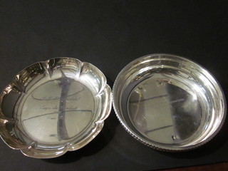 A circular white metal dish marked 800 and 1 other circular dish