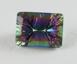 An emerald cut concave multicolour quart approx. 22.95ct