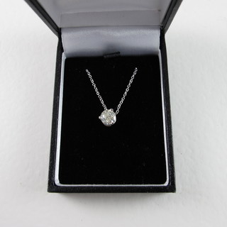 A lady's diamond solitaire pendant hung on a fine white gold chain, approx 0.50ct