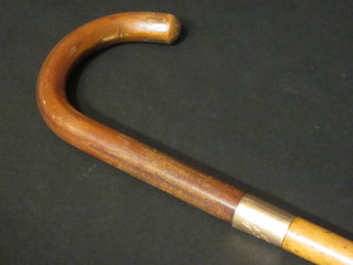 A Malacca walking cane with 9ct gold gold band