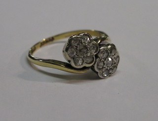 An 18ct gold cross-over floral dress ring
