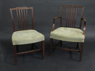 A set of 8 Georgian mahogany stick and rail back dining chairs comprising 2 carvers, 6 standard