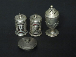 A Victorian silver pepperette and 2 pierced silver pepperettes  with red glass liners and a small silver lid