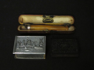 A Dutch embossed white metal match slip, a cigar holder with  gold rim and an early plastic vesta case
