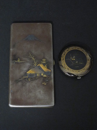 An Oriental gun metal and niello cigarette case, the reverse with signature together with a circular compact marked K24