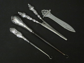 A Victorian silver book mark, London 1900, and a pair of silver  handled glove stretchers and 2 ditto button hooks