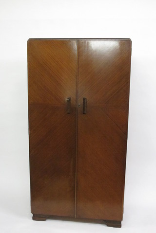 A gentleman's Art Deco mahogany fitted wardrobe by Fitrobe,  enclosed by panelled doors 37"