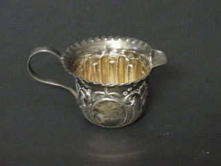 A Victorian circular embossed silver cream jug, Birmingham  1893, 1 ozs