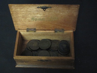 A wooden box with hinged lid containing a collection of copper coins