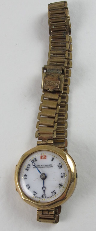 A lady's wristwatch contained in a gold case