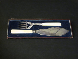 A pair of silver plated fish servers