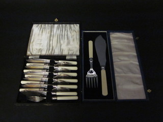 A pair of silver plated fish servers together with a set of 6 silver plated fish knives and forks, cased