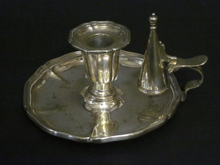 A silver plated chamber stick complete with snuffer