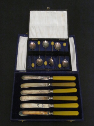 A set of 6 silver plated table knives together with a set of 6 silver plated coffee spoons