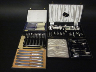 A set of 6 chromium plated dessert knives and forks, 2 sets of 6 tea knives, a set of 6 pastry forks and 4 silver plated teaspoons  and tongs, cased