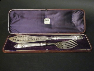 A pair of Victorian pierced silver plated fish servers, cased