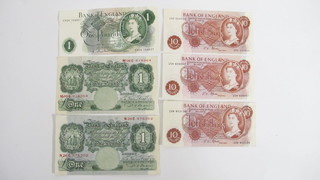 2 green œ1 notes serial no. N26C876302 and M08C918364, 3 10 shilling notes and a œ1 note