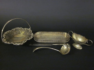 An oval silver plated twin handled dish, an oval silver plated tray, cake basket with swing handle, silver handled bread knife  and a ladle