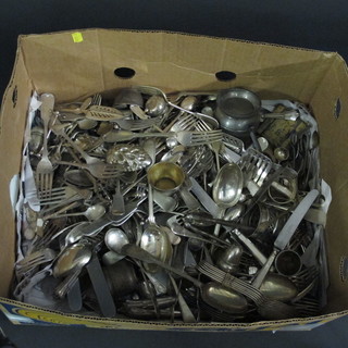 A box containing of various silver plated flatware