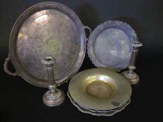 A pair of 19th Century silver plated candlesticks, an Art Deco  circular silver plated tea tray, 3 silver plated salvers and a bowl