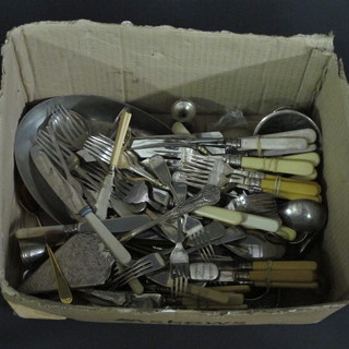 A box containing silver plated flatware