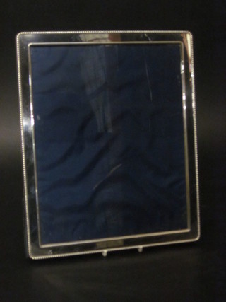 A plain silver easel photograph frame 12" x 9"