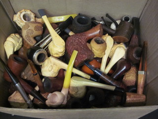 A box containing a large collection of various pipes