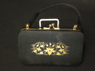 A lady's black evening bag incorporating a compact etc